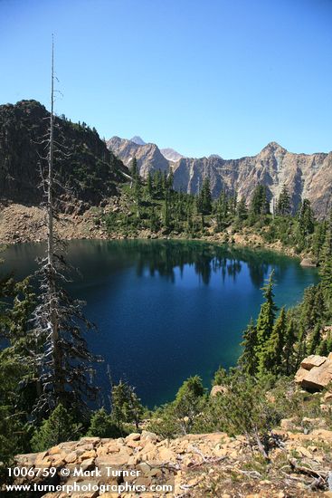 Lake Wiseman ringed by serpentine Twin Sisters Range
